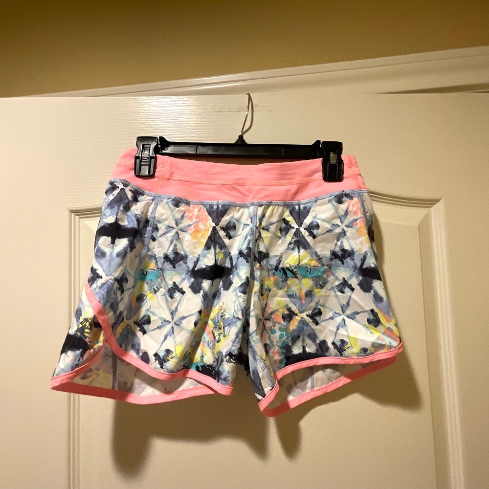 Ivivva athletic shorts with pink rim and blue colorful details. Size 14